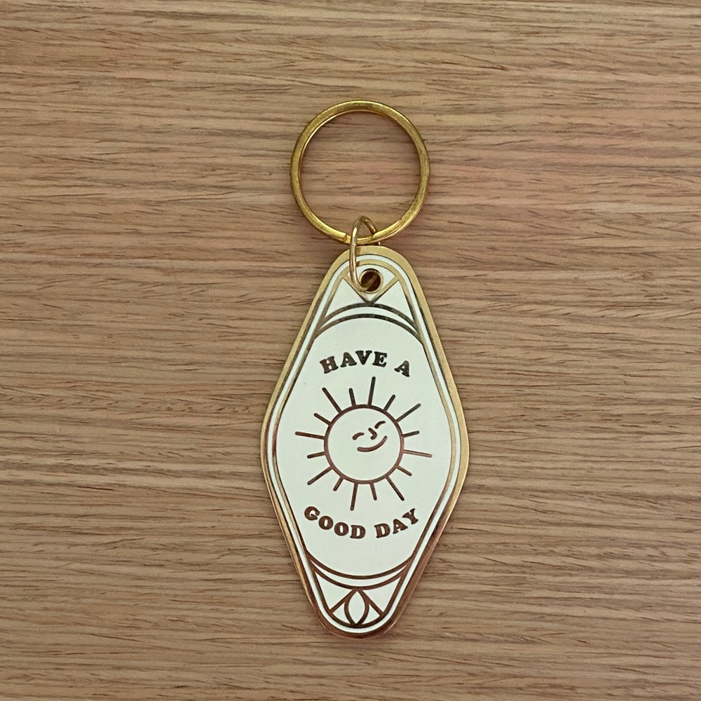 Gold and White Keychain Have A Good Day